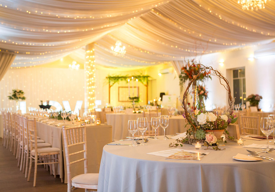 Marquee with fairy lights and tables for wedding meal at Aberdeen Wedding Venue Logie Country House